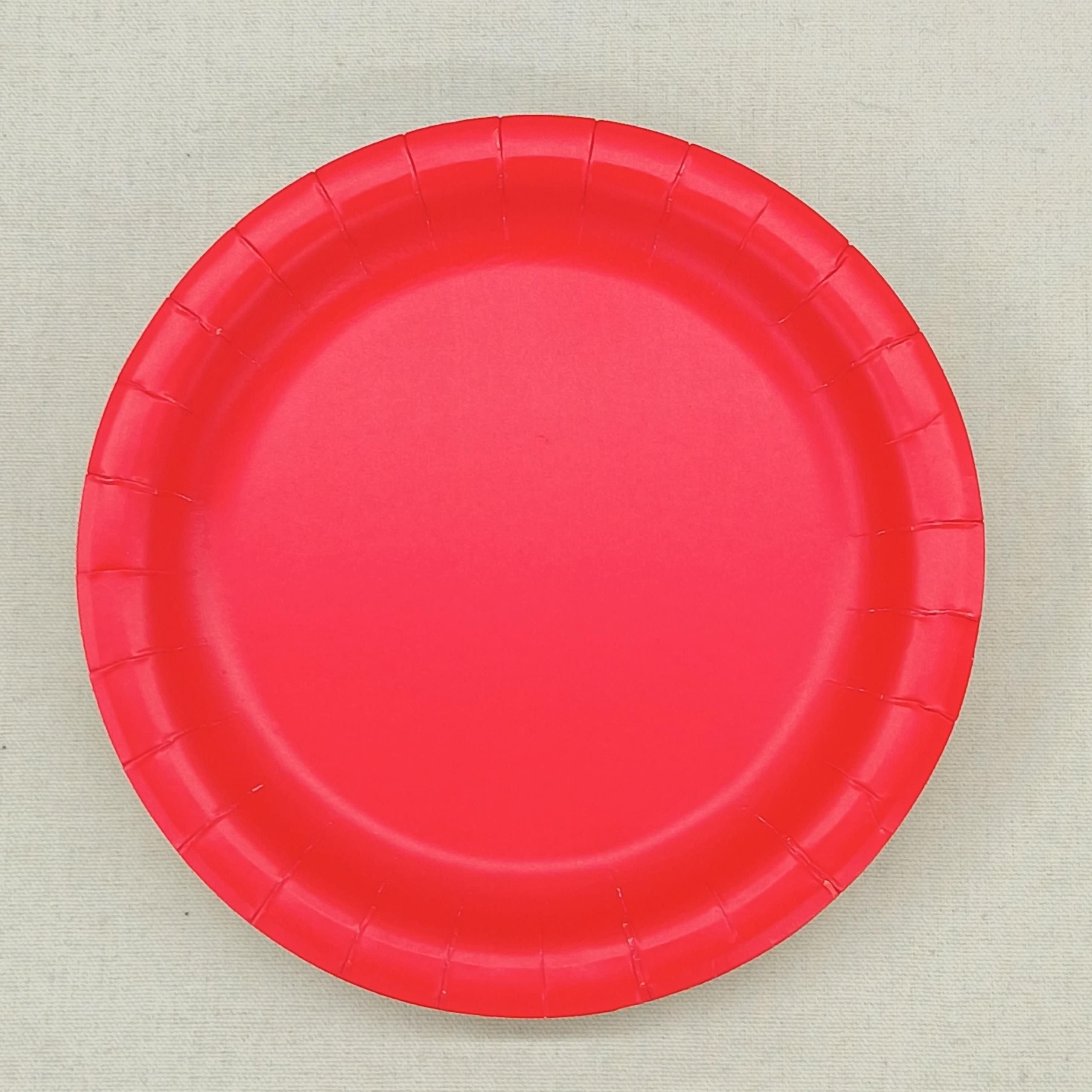 Solid red 9-inch paper party plates – real product photo