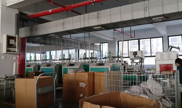 Paper plate forming machines in the Jinhua Damai factory workshop