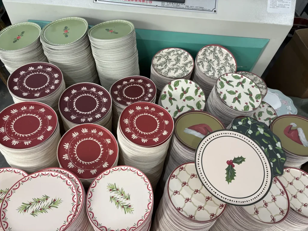 Finished Christmas paper plates in holly and red-green prints