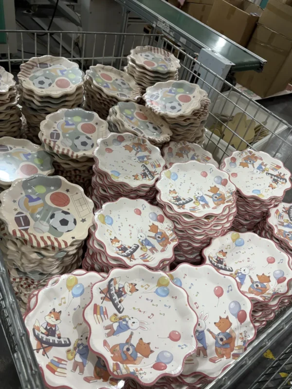 Finished kids theme scalloped paper plates ready for packing