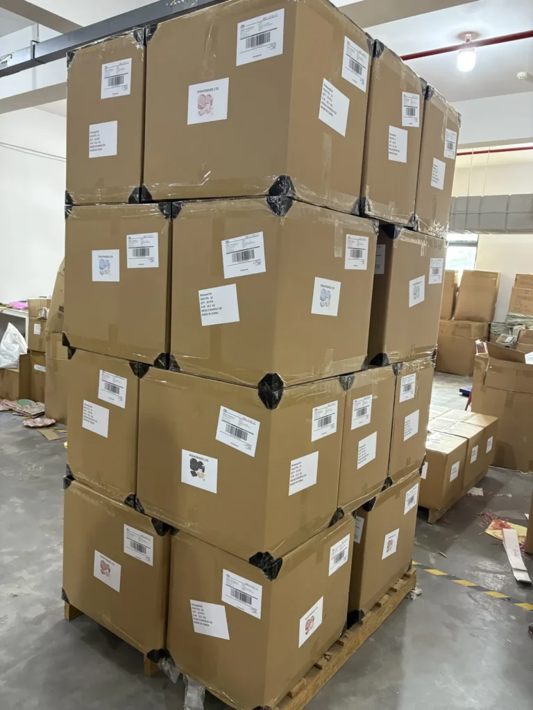 Palletized and stretch-wrapped export cartons of party supplies
