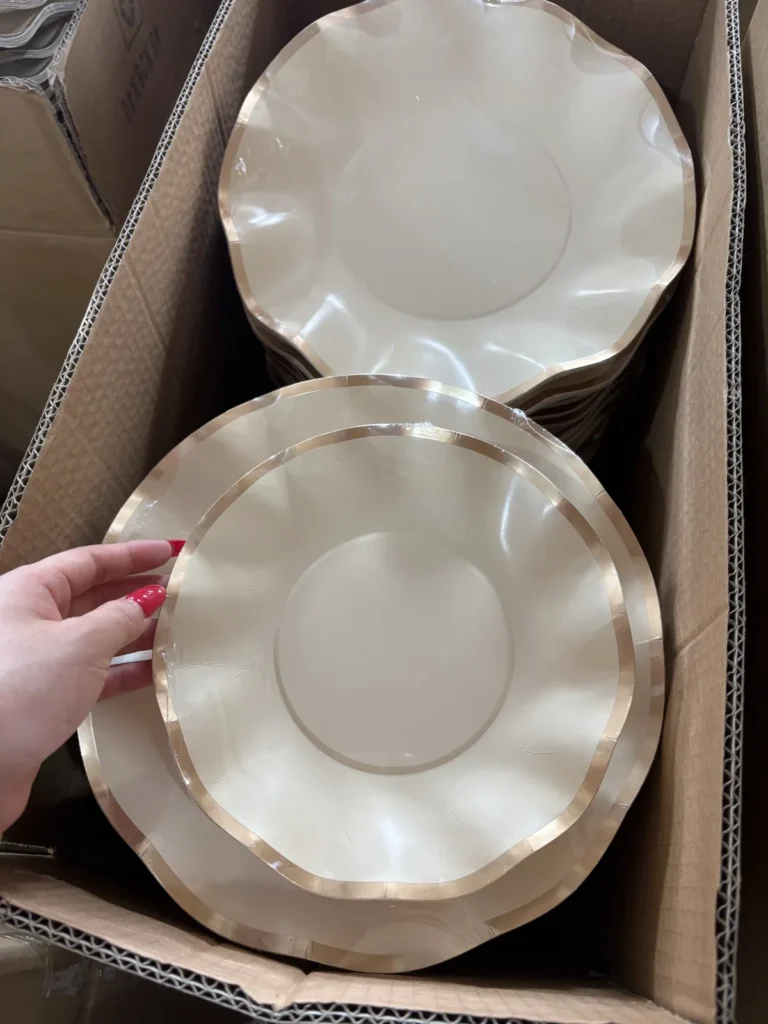 Rose-gold ruffled paper plates packed for shipment