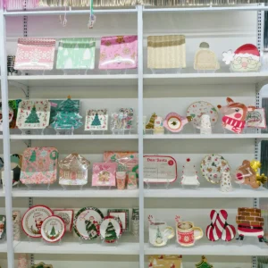 Christmas paper plates, cups and napkins on display in the Damai showroom