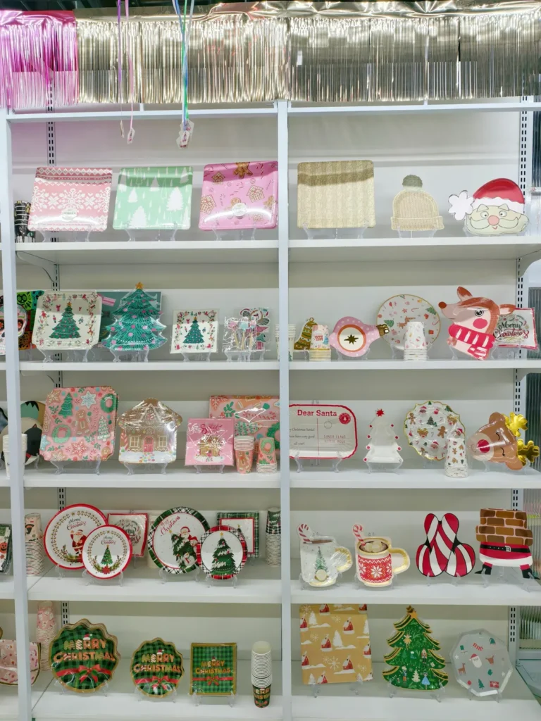 Christmas paper plates, cups and napkins on display in the Damai showroom