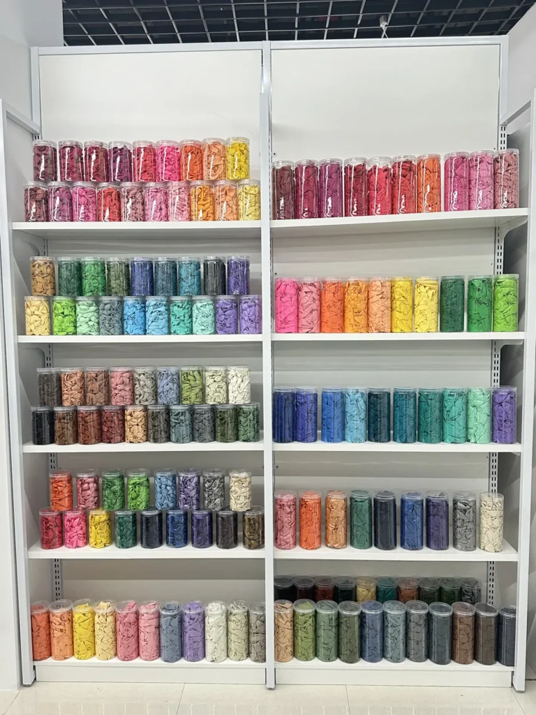 Confetti and sequin product wall in the Damai Party showroom