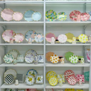 Floral paper plate samples on the wall of the Damai Party showroom in Yiwu