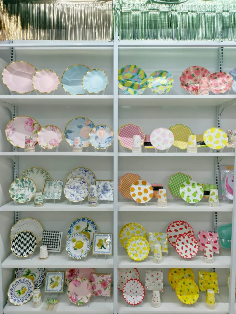Floral paper plate samples on the wall of the Damai Party showroom in Yiwu