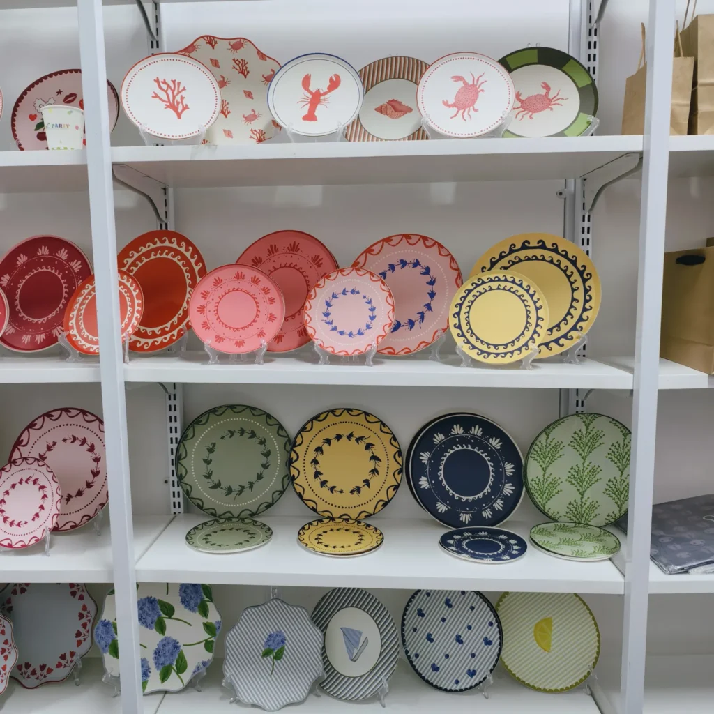 Hand-painted style paper plates displayed in the Damai showroom
