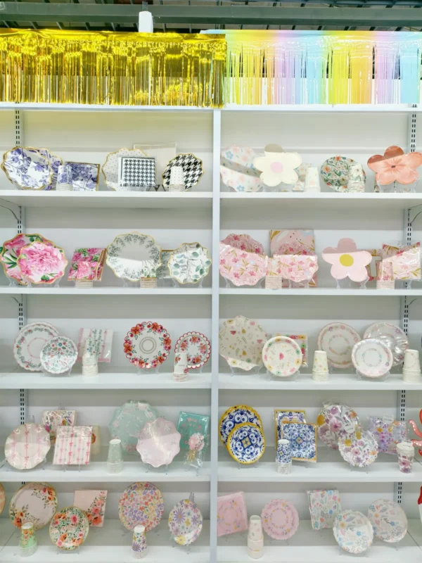Scalloped floral paper plates on showroom shelves